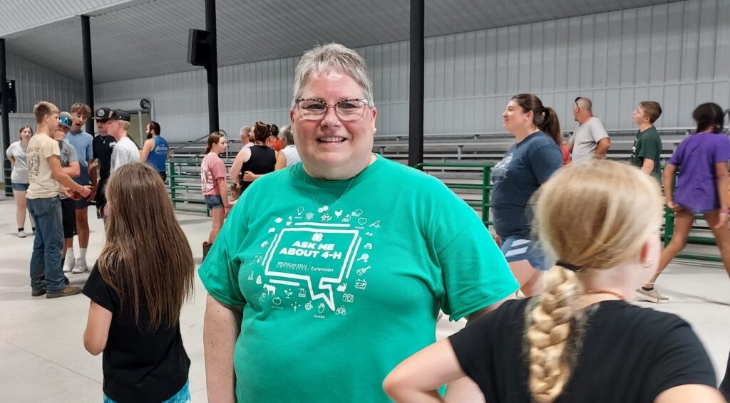 Janelle Stewart, Lenawee County 4H program coordinator for the Michigan State University Extension, is pictured at the dedication of the new show barn on July 19. (Photo by Julie C. Clemes)