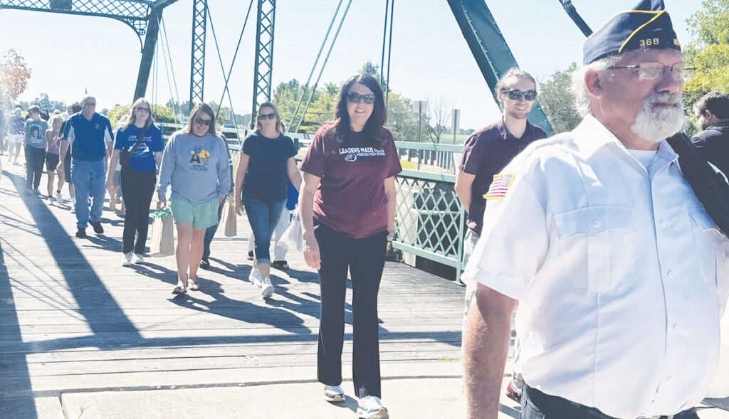 People cross Silver Creek during Morenci’s annual Labor Day bridge walk in 2024. (Courtesy of the City of Morenci)
