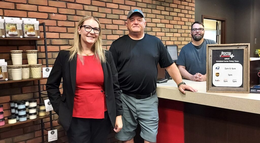 Angela Moore, Scott Cremeans and Pat Brooks are pictured inside Postal Plus’ new location. (Photo by Julie C. Clemes)