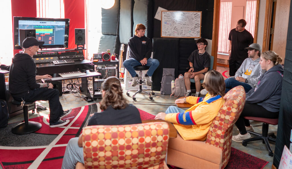Pete Bishop (at left) and his students begin each session by gathering together just to talk about their day. Everyone mentions something that has gone well for them that day and something that has not gone the way they had hoped. (Photo by Lad Strayer)