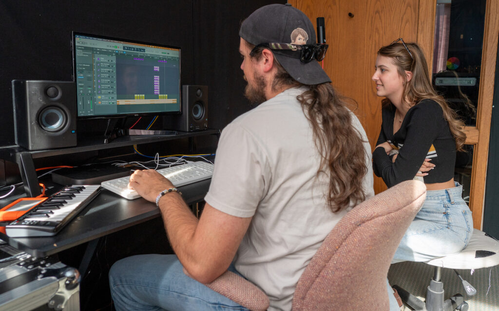 Siblings Aiden and Araya Morgan work on editing the vocals on one of Araya’s compositions. The training at Above Pete’s Garage includes the technical aspects of music recording and mixing. (Photo by Lad Strayer)