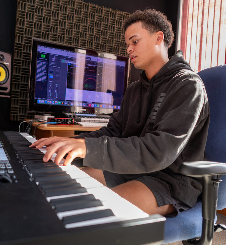 Taye Louden 16, works on his instrumental portfolio. (Photo by Lad Strayer)