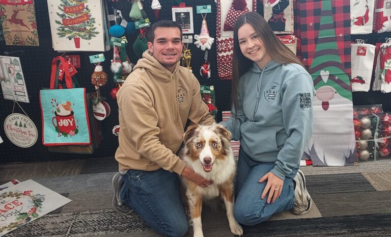 Collin and Kylee Blevins, pictured with their dog, Nina, are the owners of The Deal Depot on West Maumee Street in Adrian. (Photo by Julie C. Clemes)