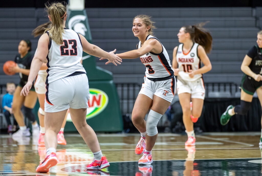 Tecumseh’s Makayla Schlorf (3) gets a quick five from teammate Ashlyn Moorehead during last season’s Division 2 championship game. (Photo courtesy of MHSAA)