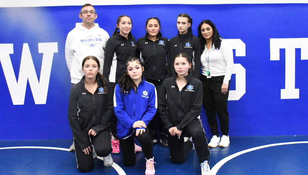 The first Adrian High School girls varsity wrestling team: In the back row, from left to right, are assistant coach Brandon Chesher, Alayna Rosas, Natalia Rosas, Shaylnn Parsell, and coach Natasha Taylor; and in the front row, Isabella Novak-Rojo, Avyana Garza, and Isabella Chesher.