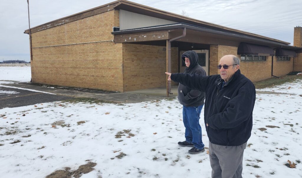 Township supervisor Dave Pixley, right, with fire chief Paul Rohlan, shows the site where the new Palmyra Township fire station will be built next to the township hall. (Photo by Erik Gable)