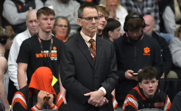 Scott Marry monitors the action on Feb. 28 after becoming the state’s all-time winningest wrestling coach during the semifinals earlier that day. (Photo courtesy of MHSAA)