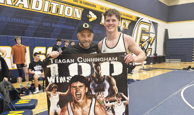 Teagan Cunningham, right, with Onsted coach Tyler Boss, celebrated his 100th career win this year, a milestone he reached after a medical setback in the previous season. (Photo courtesy of Tyler Boss)