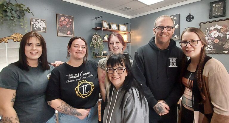 Pictured at Twisted Canvas Tattoo in Morenci are, in the back row, Heather VanDalen, Kaitlin Brubaker, Alaina Luke, Jason Sturmer, and Rachel Sturmer, and in front, Kelsie Patrick. (Photo by Julie C. Clemes)
