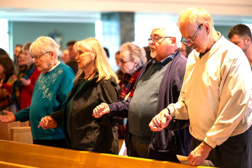 Alumni gather for SHU's Homecoming Mass. (Photo by Laura Harvey for Siena Heights University)