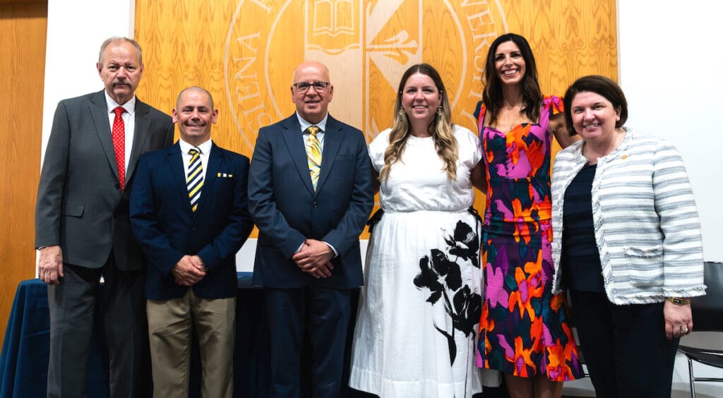 Siena Heights University alumni award recipients Paul T. Zdanis '81 (Sister Ann Joachim Award), Dan Pena '01, '08 (Saint Catherine of Siena Award), Ted C. Hanosh '91, '99 (Saint Dominic Award), Bobbi J. Pudrith (Hill) '11 (Saint Dominic Award), and Brianna N. Kuhatschek '12 (Saint Catherine of Siena Award) are pictured with SHU president Cheri Betz. (Photo by Laura Harvey for Siena Heights University)