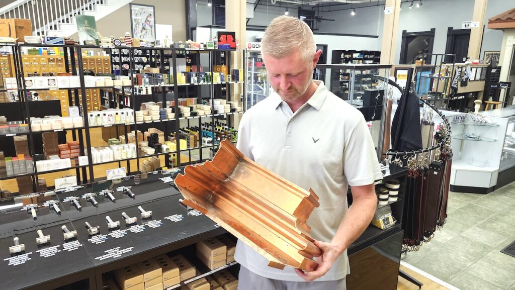 Brad Maggard shows an example of the custom copper work that went into the restoration of 124 S. Winter St.