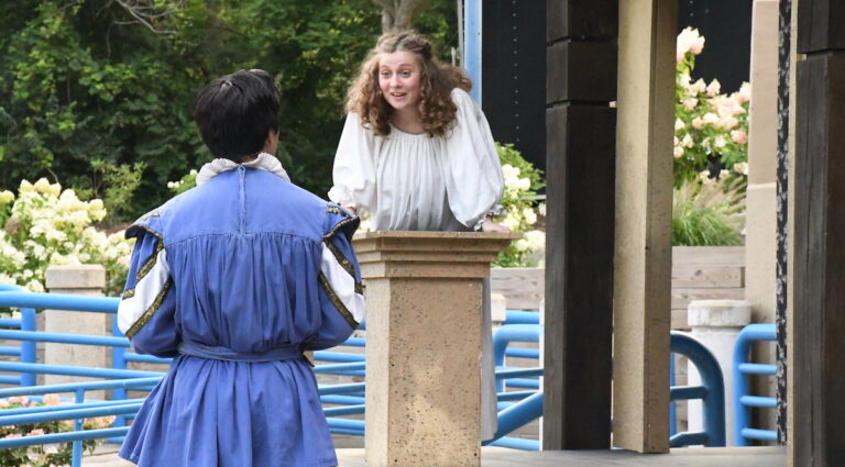 Ella Flumignan as Juliet speaks from her balcony to Eli Stachowske as Romeo in a scene from the Adrian Shakespeare Co.'s production of "Romeo & Juliet" in Adrian's Trestle Park.