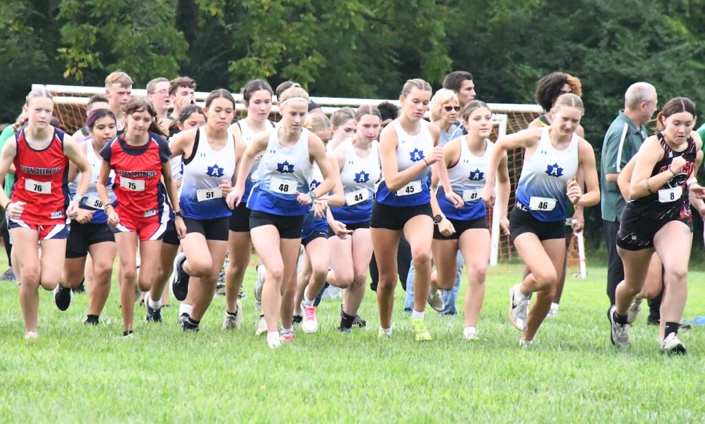 Adrian cross country teams got off to a good start at the Lenawee County preview meet on Aug. 22, with both boys and girls finishing first overall and senior Ayda Skeels capturing first place in the girls' race. (Photo by Erik Gable)