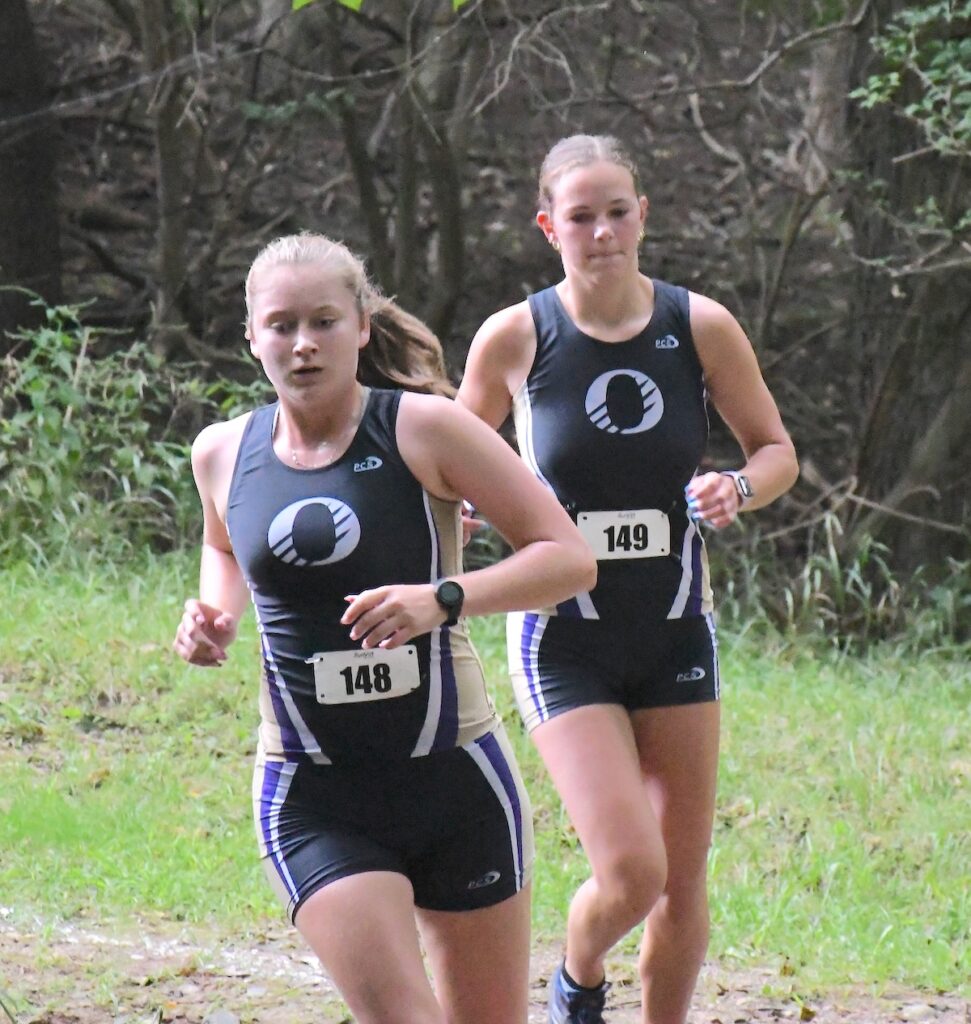 Onsted’s Mattie Hallenbeck and Izzy Raglow compete in the Lenawee County cross country preview meet on Aug. 22.