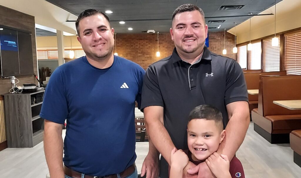 Alex and George Trejo are pictured along with George's son, Max, shortly before the brothers opened The Golden Griddle in the former Big Boy restaurant in downtown Adrian.