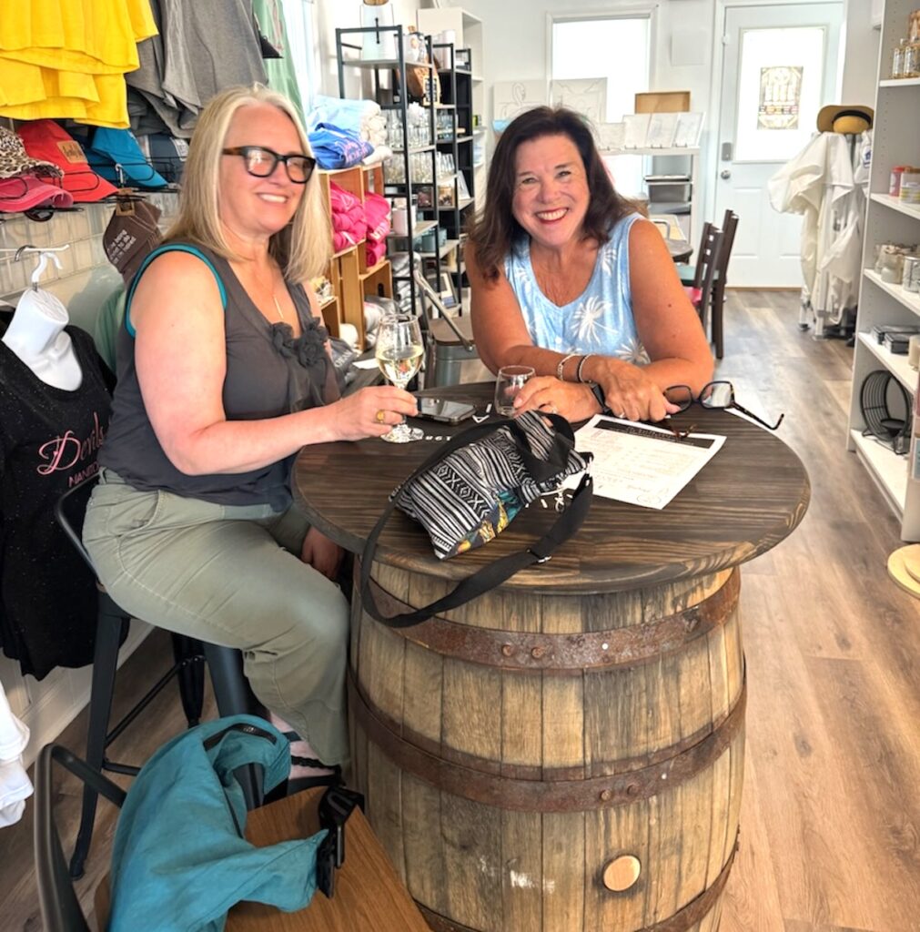Kelly Stickel and Pam Rogers enjoy a glass of wine inside Ang & Co. (Photo courtesy of Dave Gajda and Jose Malagon)