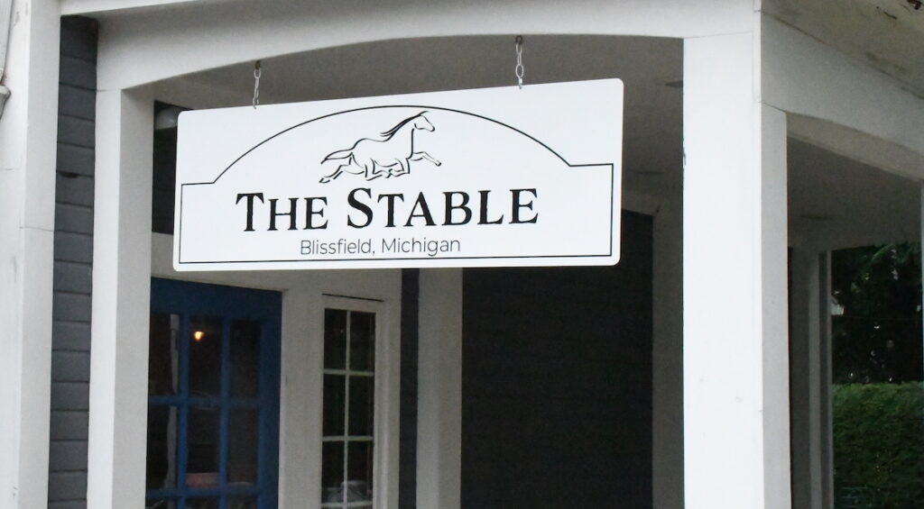Entrance to The Stable is now through the parking lot behind the building on 116 Main St. in Blissfield.