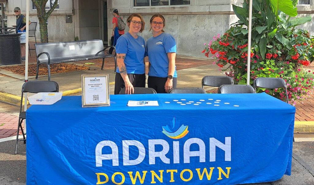 Christy Mesaros-Winckles, left, is pictured with Adrian City Market manager Ella Beddingfield at Adrian First Fridays on Sept. 4. (Photo by Arlene Bachanov)
