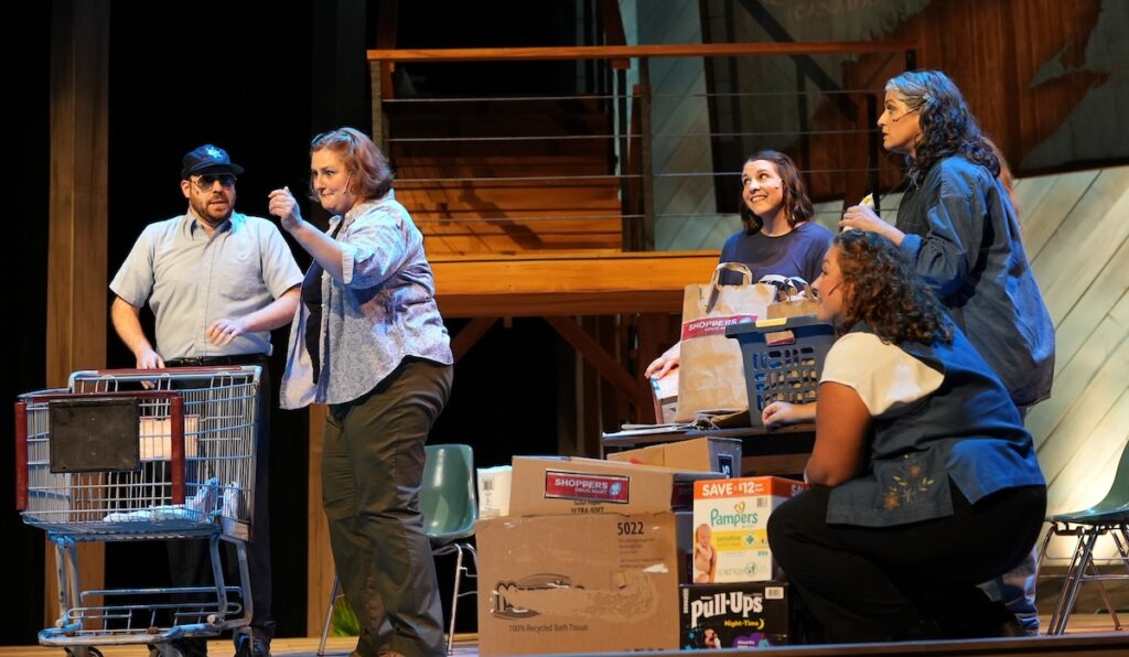 The citizens of Gander rally to help the stranded passengers in a scene from "Come From Away." (Photo by Lad Strayer)