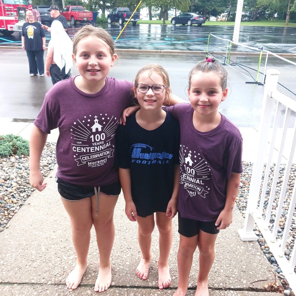Jayde Pike, Matilda Oates and Abigail Pennington enjoy the centennial celebration.