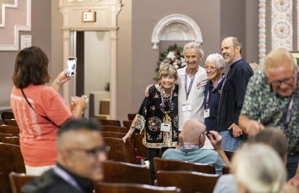 Jan and Tom Sura, their friend Trudy McSorley, and son Matt Sura pose for a photo during a reunion at the Croswell Opera House. The reunion was attended by Croswell artists, volunteers and patrons from the 1960s to present. (Photo by Ashlee Sayles)