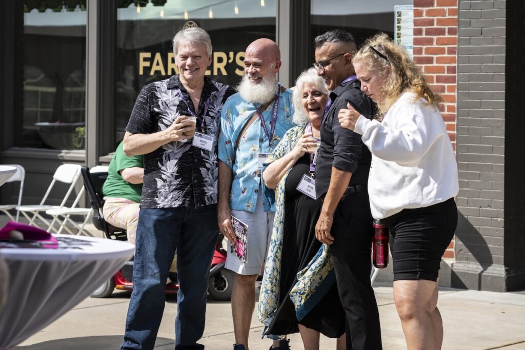 Michael Lackey, Nolan Hines, Betsy Lackey, Rudy Gauna and Alaina Kuehn share a laugh at the Croswell reunion on Aug. 7. (Photo by Ashlee Sayles)