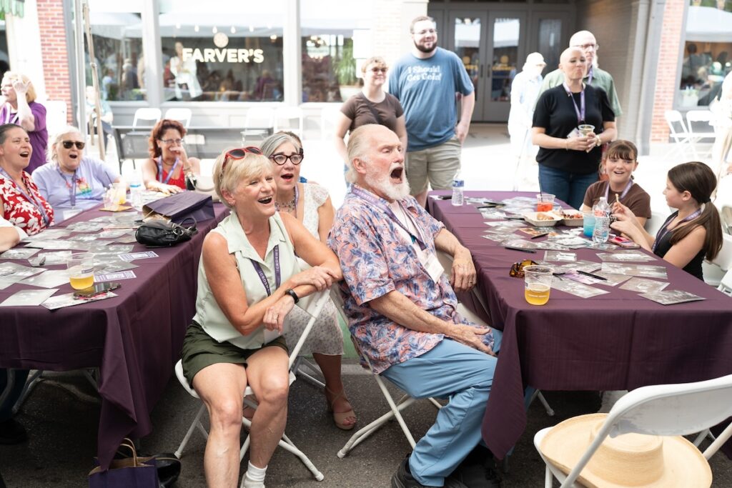 Among the activities at the Croswell’s reunion on Aug. 7 were a pair of Broadway singalongs led by Todd Schreiber. Pictured here, in the foreground, are Jay Hillard, Johanna Hanley, and Steve Hillard. (Photo by Lad Strayer)