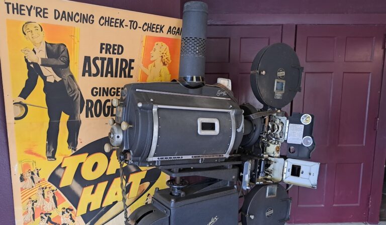 An old projector and movie poster are pictured in the lobby of the Star Theatre in Brooklyn.