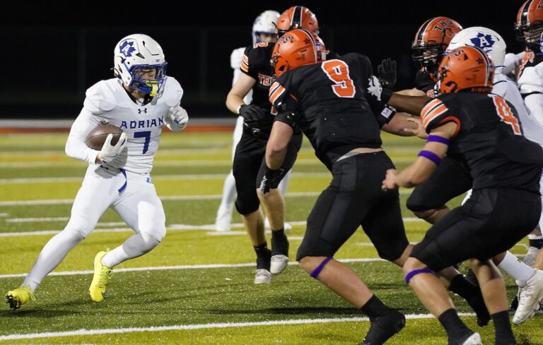 A touchdown and a two-point run by Luke Bruggeman gave Adrian the win in a hard-fought game against Tecumseh on Oct. 2. (Photo by Mike Dickie, mikedickiephotography.smugmug.com)